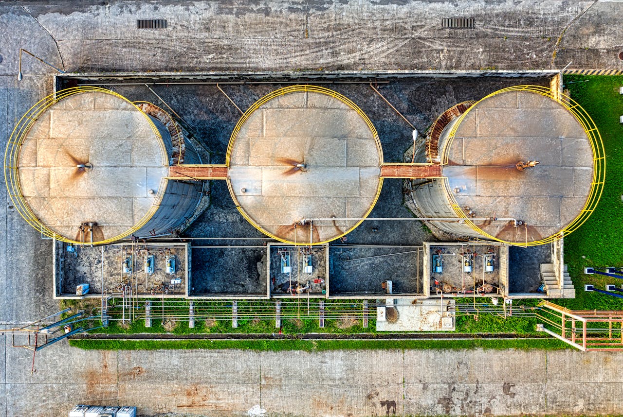Aerial shot of three industrial oil storage tanks in Banten, Indonesia.